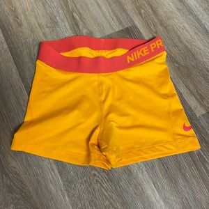 Women’s nike pro athletic shorts. Orange